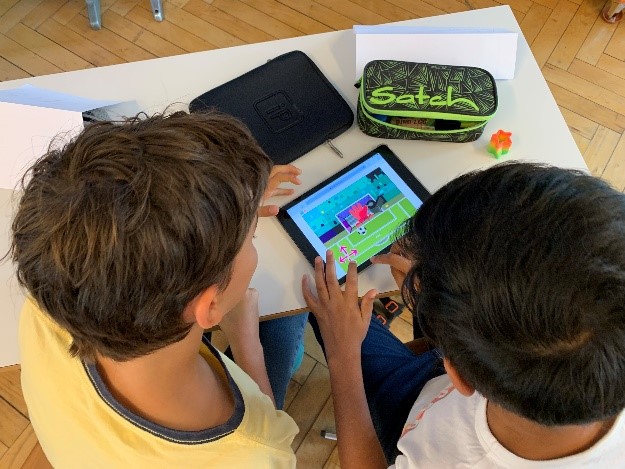 Pupils working on Scratch