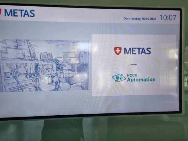 Picture of sign displaying NCCR Automation and METAS logos