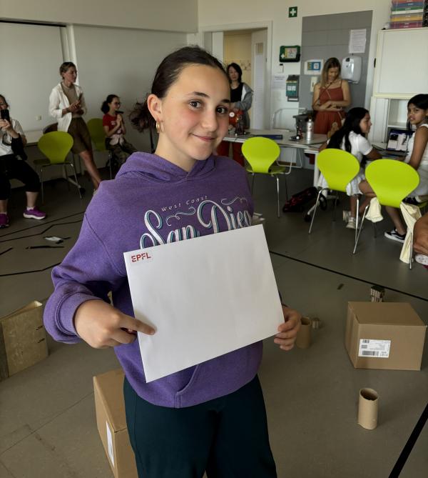 A girl holding a certificate