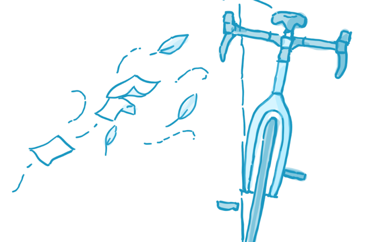 A gust of wind pushes a bicycle off balance, but it returns to the upright position.
