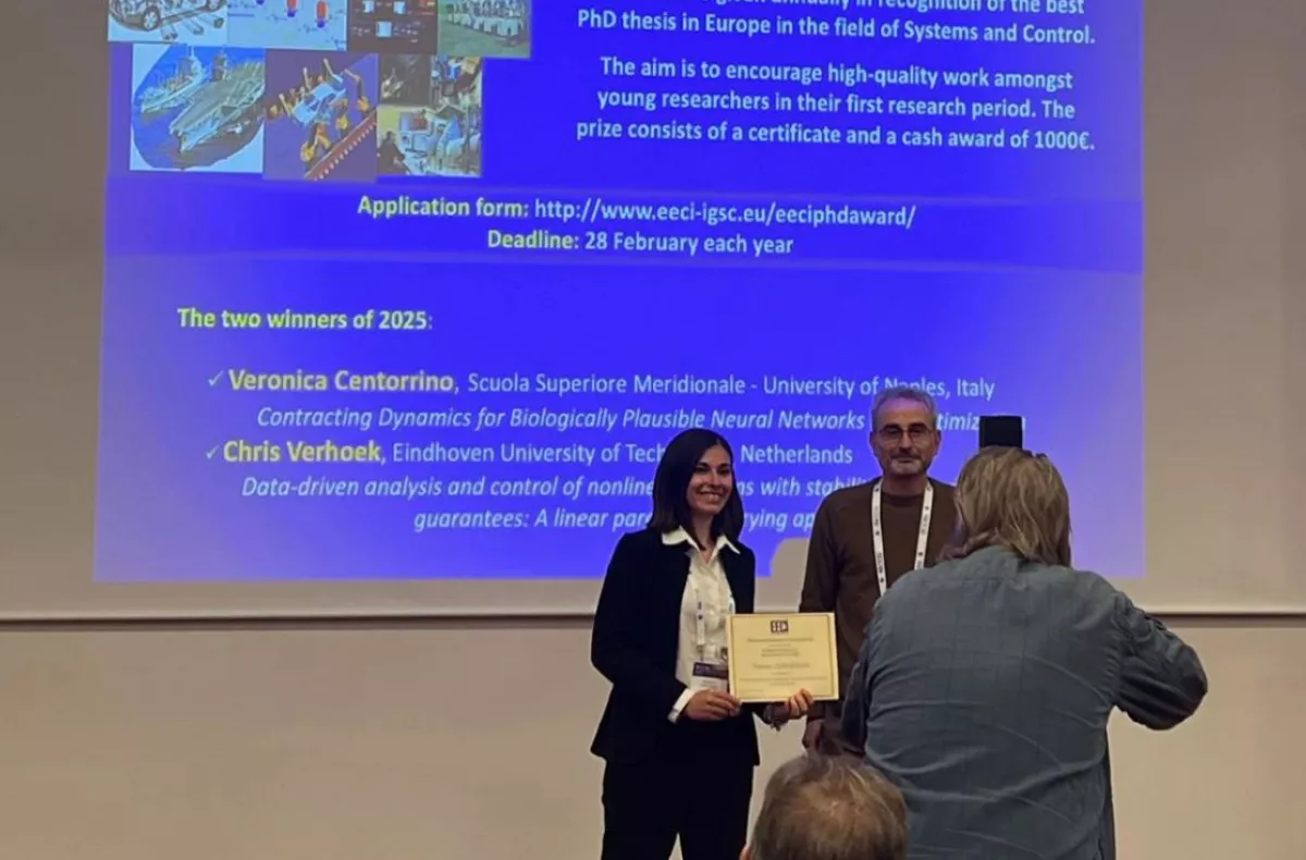Veronica accepts the award
