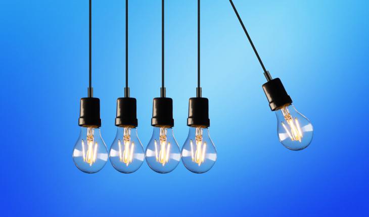 newton's cradle made of lightbulbs