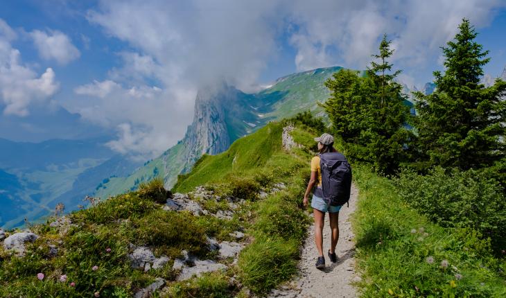 Photo of woman hiking in Swiss mountains