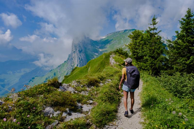 Photo of woman hiking in Swiss mountains